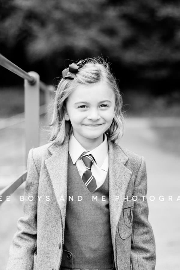portrait of little girl In school uniform at her back to school Kent mini photoshoot