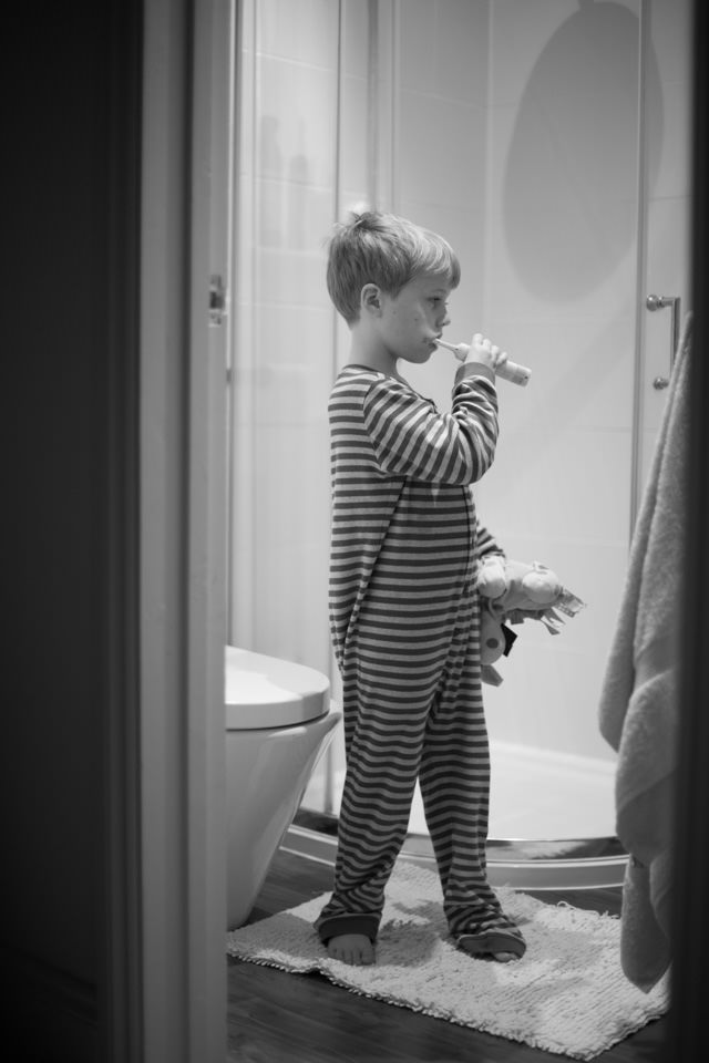 brushing your teeth, young boy with his new toothbrush Sevenoaks Family photographer 3 Boys and Me Photography