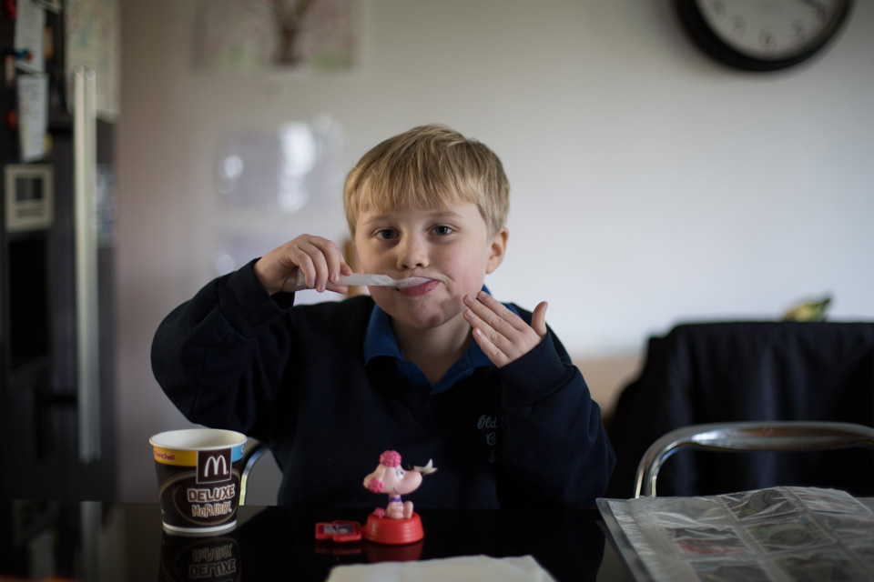 young boy eating a McDonalds McFlurry Sevenoaks Family photographer 3 Boys and Me Photography