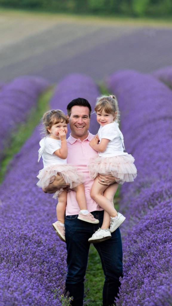 dad and his two daughters taken at their Kent family lavender photoshoot