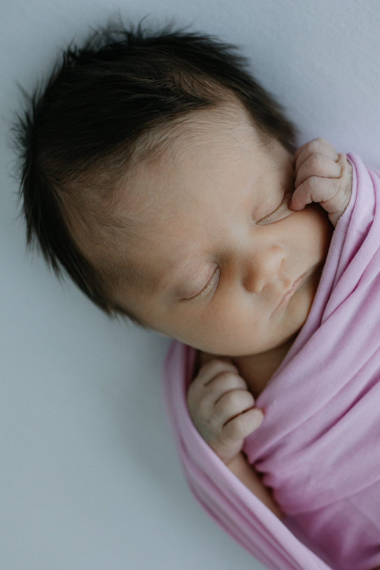 close up shot of newborn baby sleeping at her kent newborn photoshoot in bexley