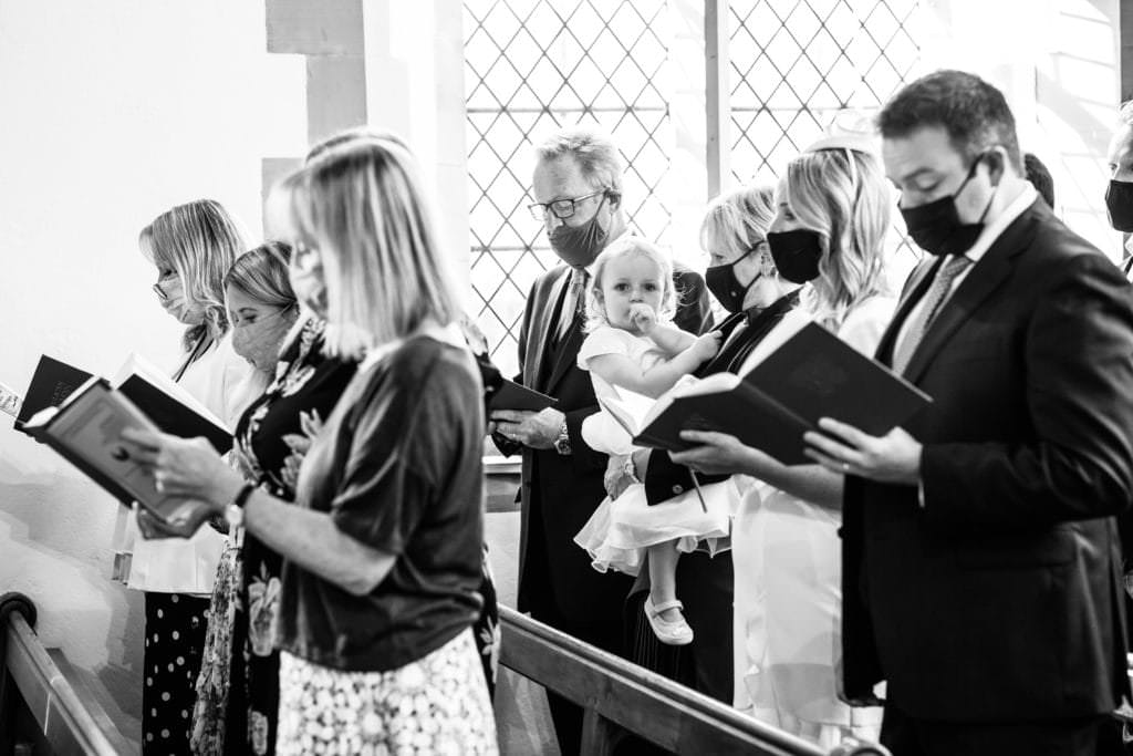 kent christening during covid times showing masks being worn during the service by kent christening photographer nina callow 3B&ME Photography Kent