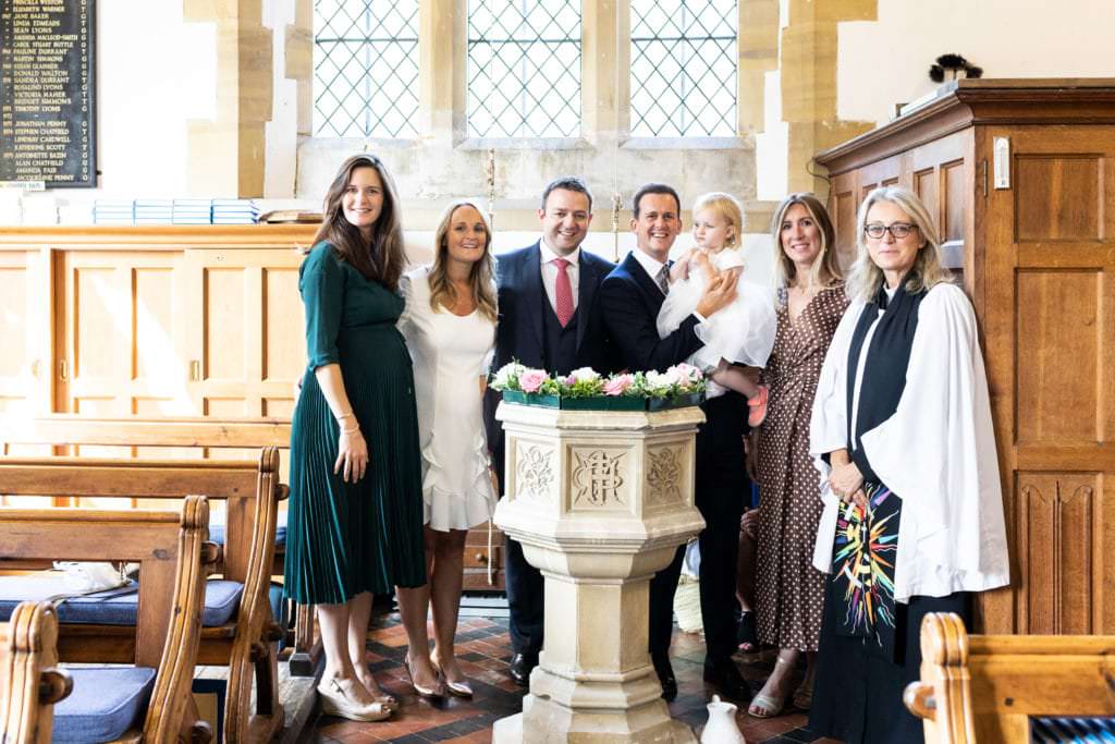 godparents, parents and vicar standing round the font by kent christening photographer nina callow 3B&ME Photography Kent