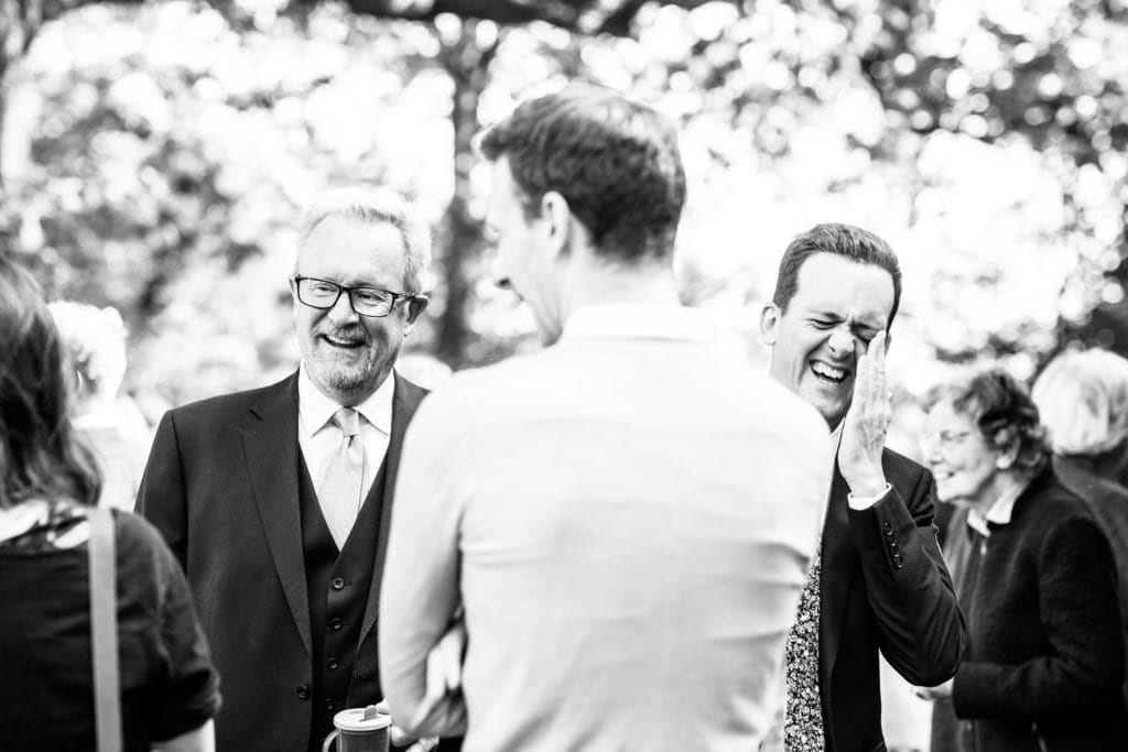 black and white candid image taken during a church service by kent christening photographer nina callow 3B&ME photography kent