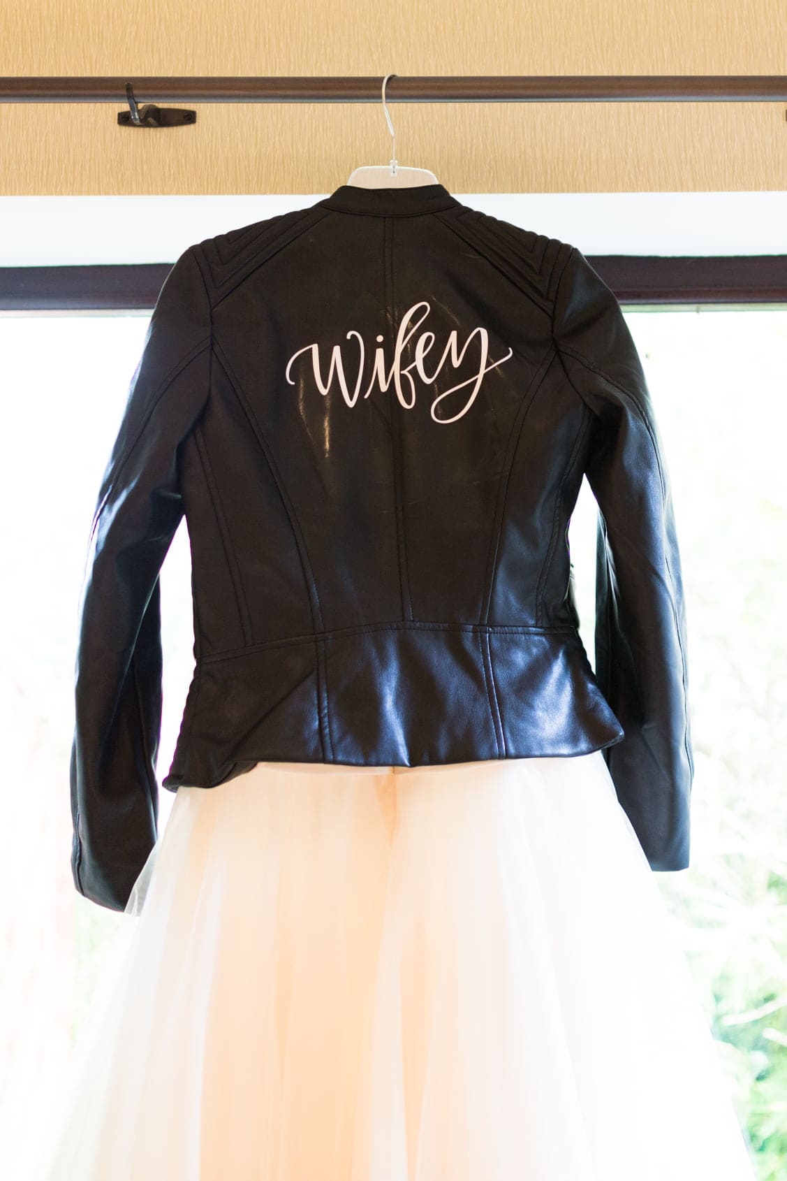 brides dress and wifey leather jacket shot at a Kent weddings