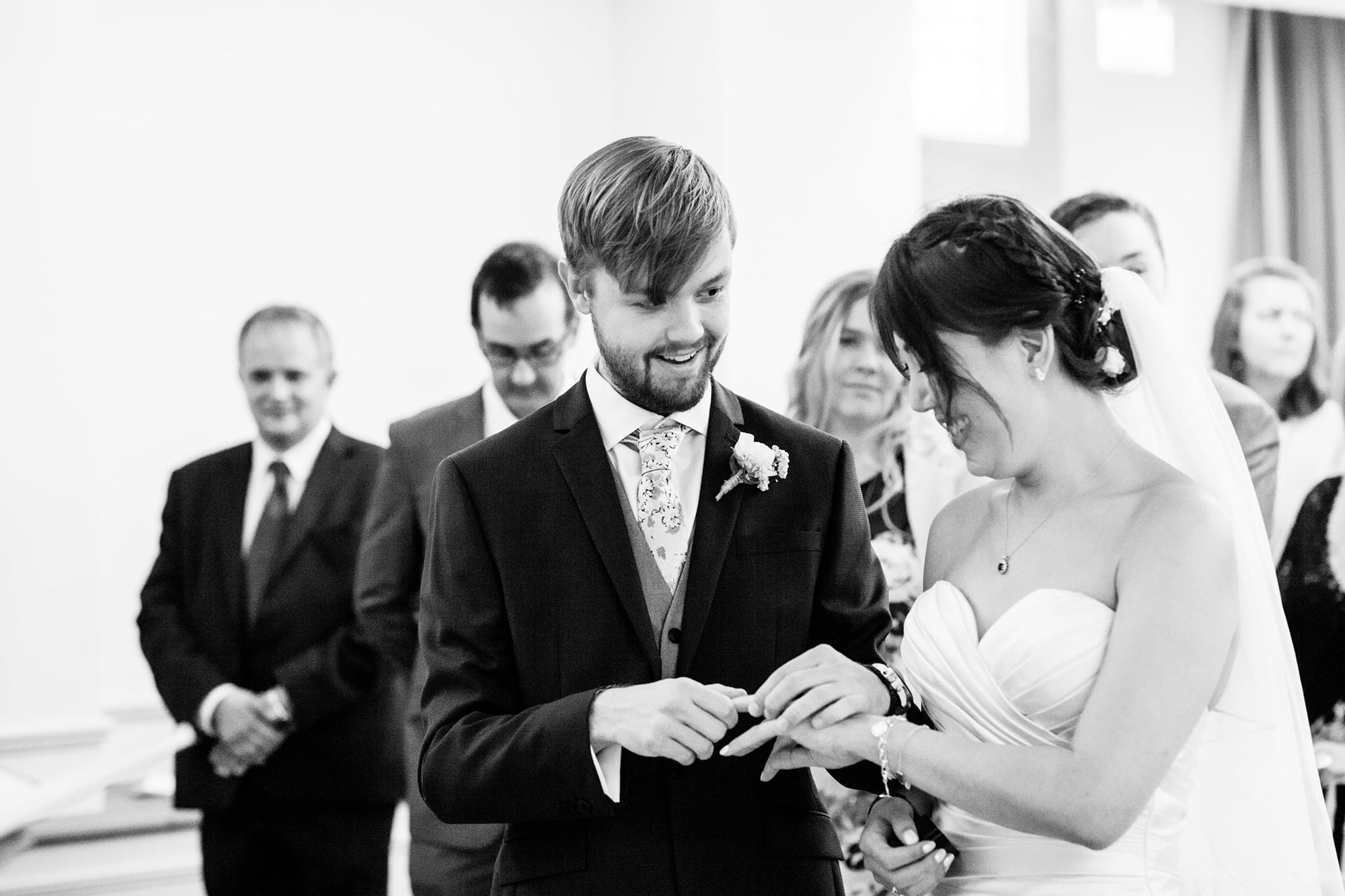 bride and groom exchanging rings at Selsdon Estate Weddings Kent wedding photography