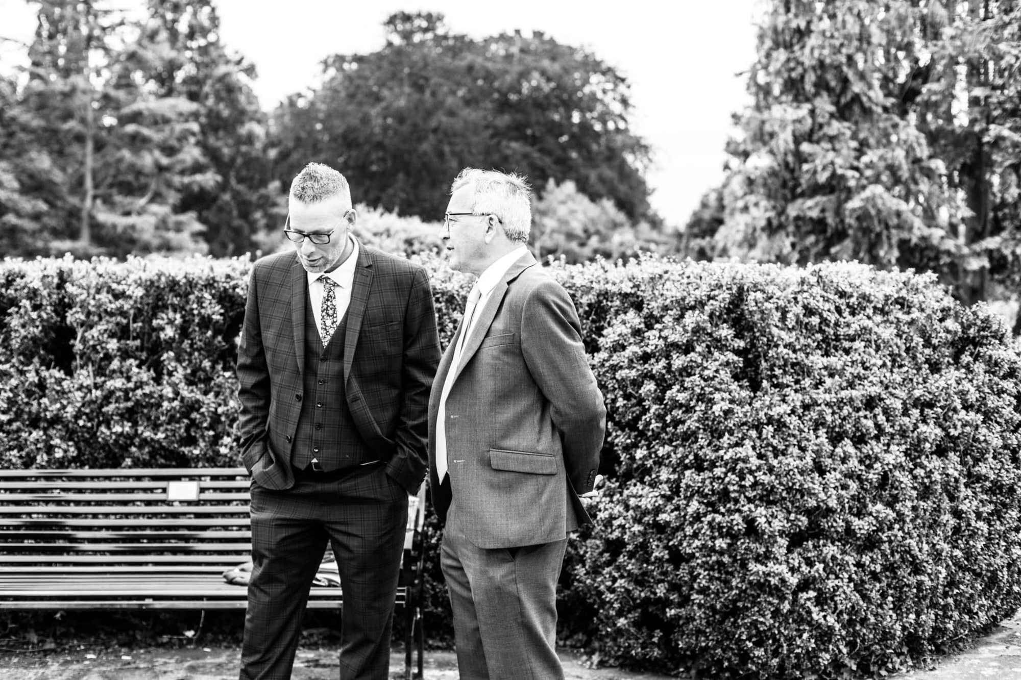 image of two men chatting take at a Kent micro wedding at Danson House Bexleyheath
