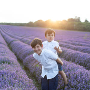 piggy back in the Kent Lavender fields at a Kent Lavender photoshoot