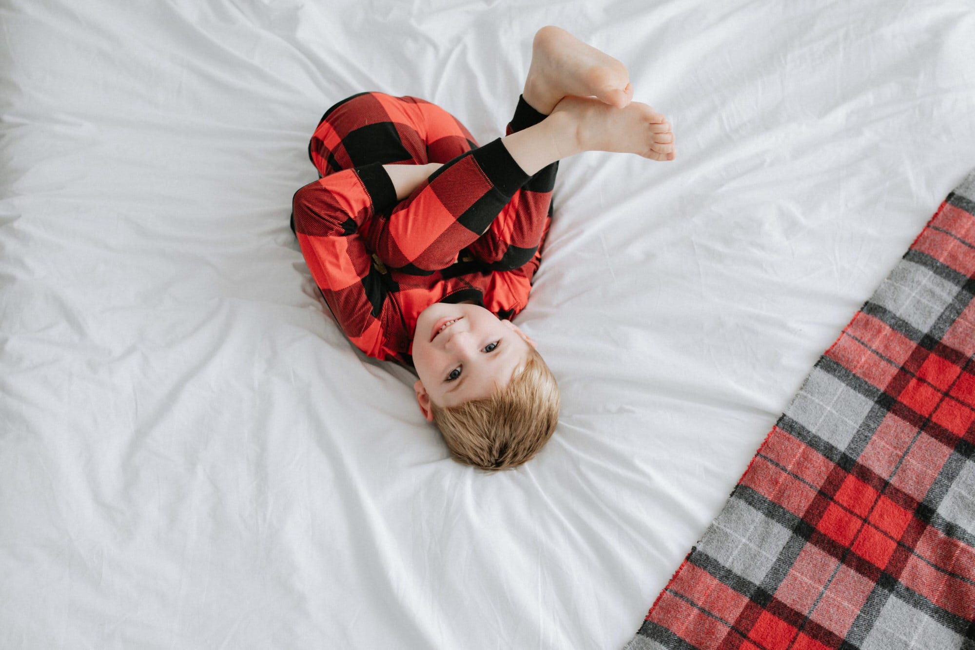 little boy in Christmas pyjamas at his Kent Christmas mini photoshoot in Bexley