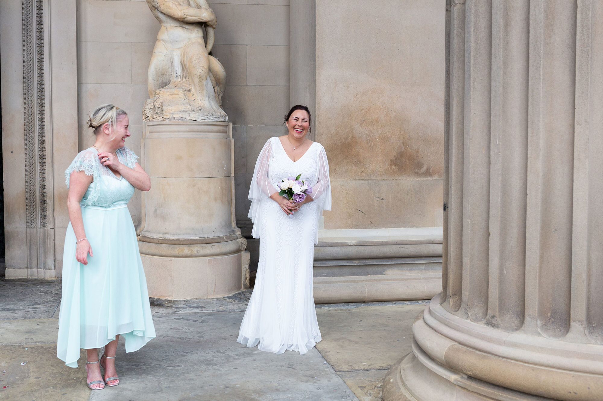 Bride and her bridesmaid St Georges Hall Liverpool covid micro wedding shot by Kent micro wedding photographer