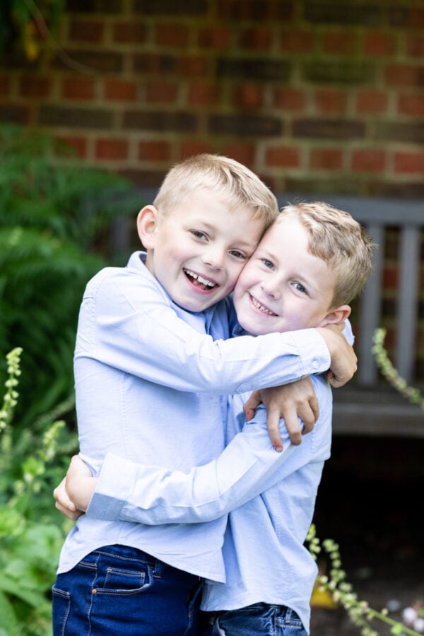 two brother cuddling on their kent family photoshoot in Sevenoaks