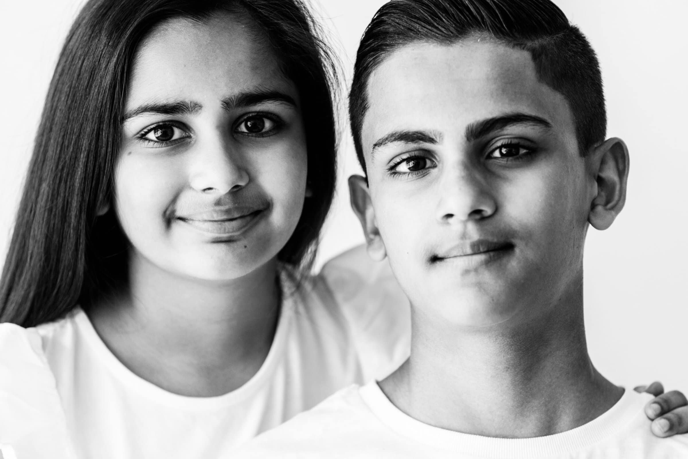 black and white image of a brother and sister taken at their kent modelling portfolio update shoot in bexley