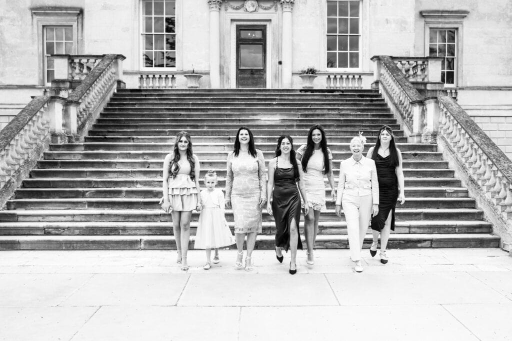 here come the girls, shot in black and white wedding party walking towards the camera at Danson House Bexleyheath Wedding