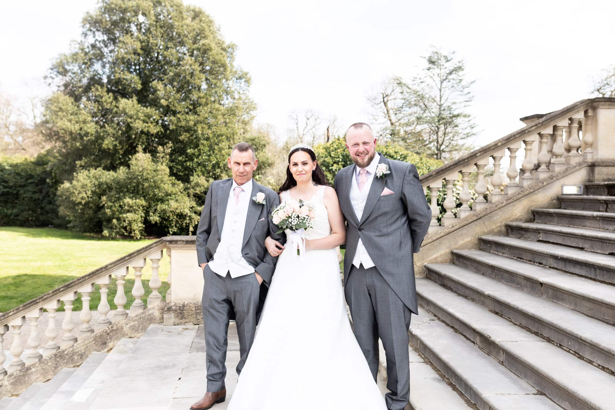 bride groom and father of the bride on the steps of Danson House Bexleyheath photographed by Kent Micro wedding specialist