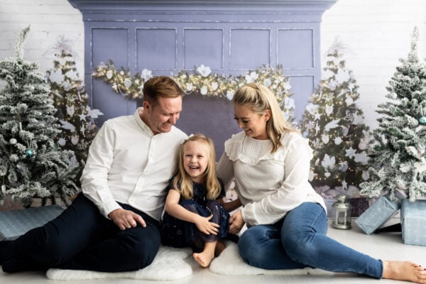 mummy, daddy and their little girl at their bexley christmas mini photoshoot in bexley