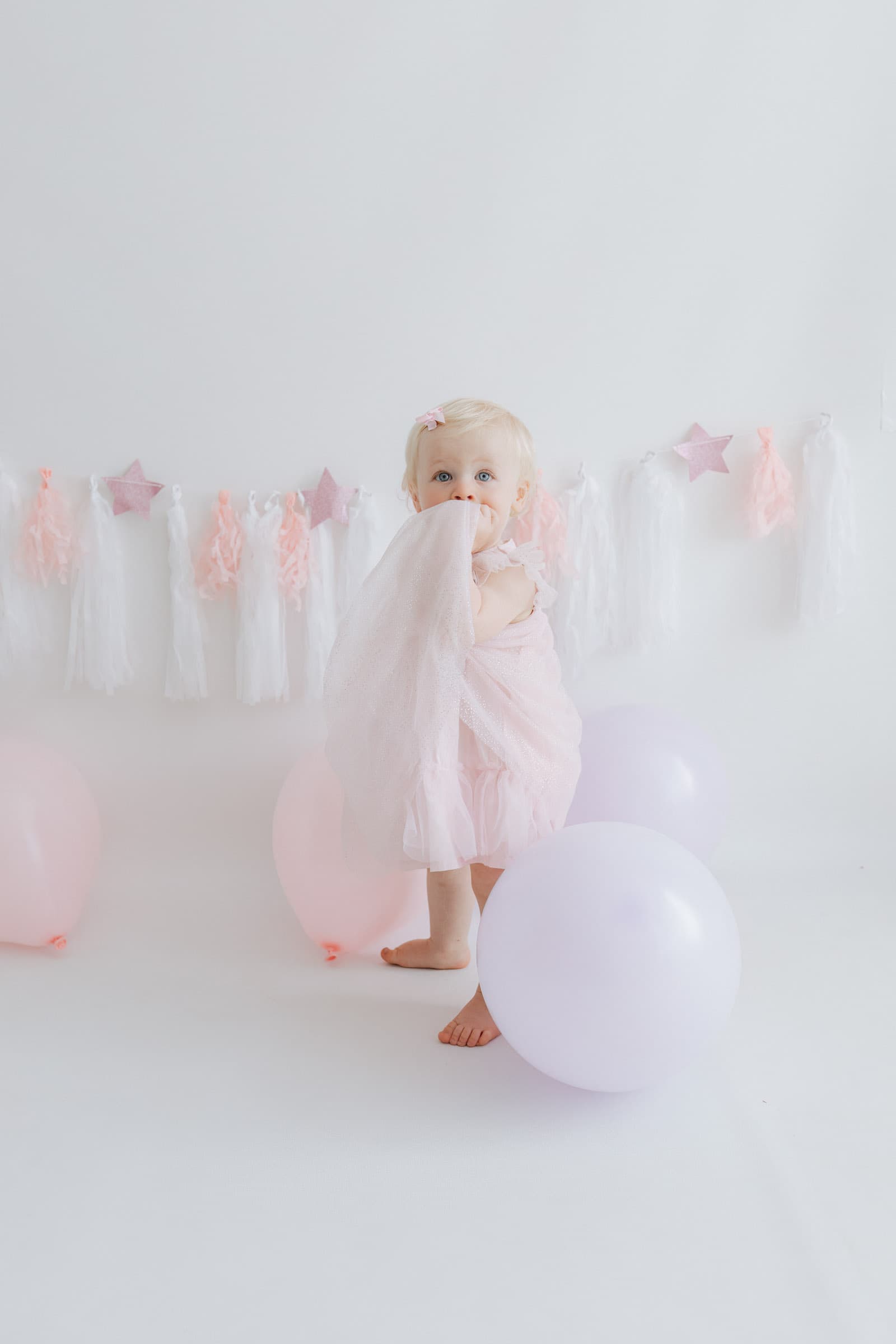 little girl in pink at her first birthday baby studio photoshoot in bexley kent